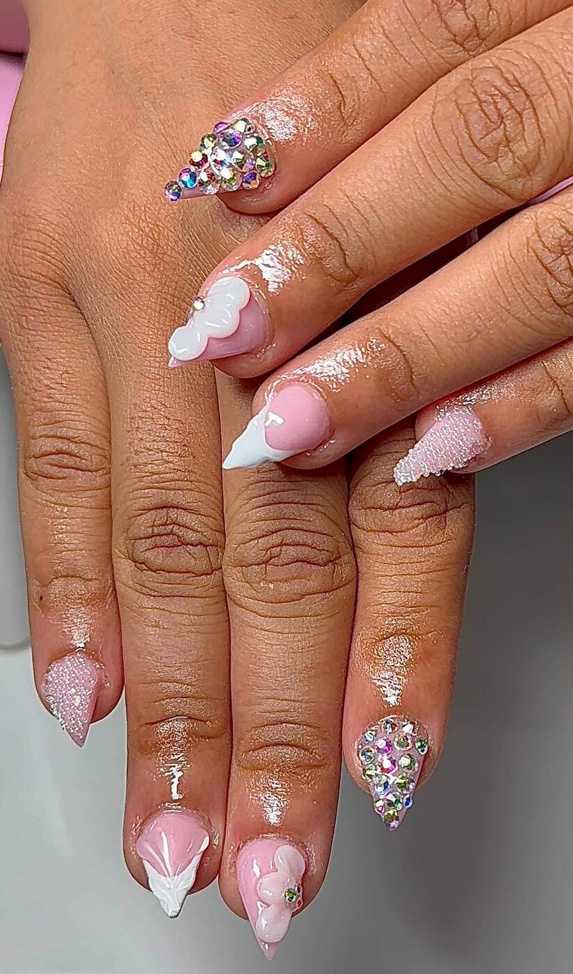 Pink stiletto nails with 3D flowers and rhinestones