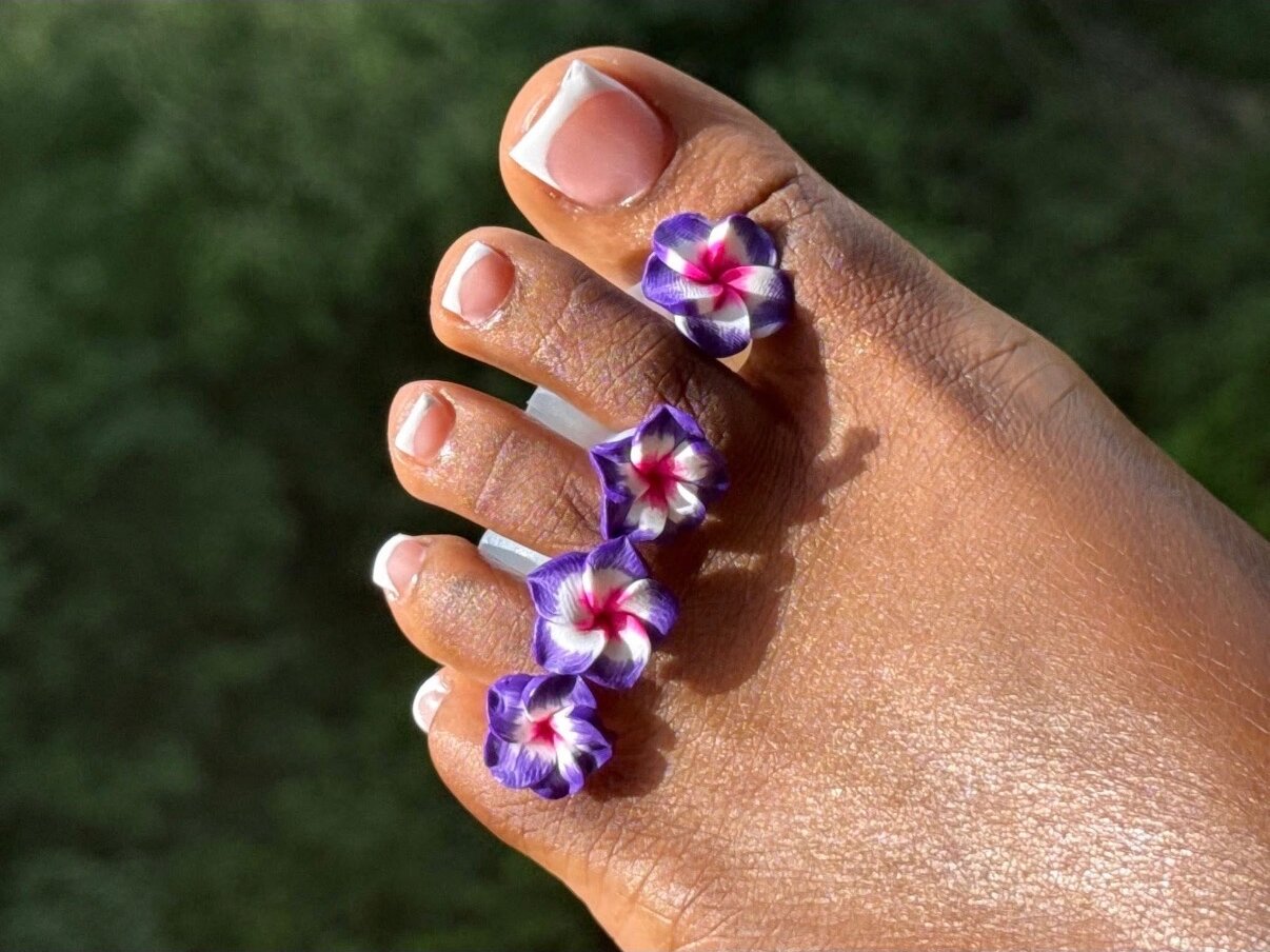 French pedicure with purple 3D flowers