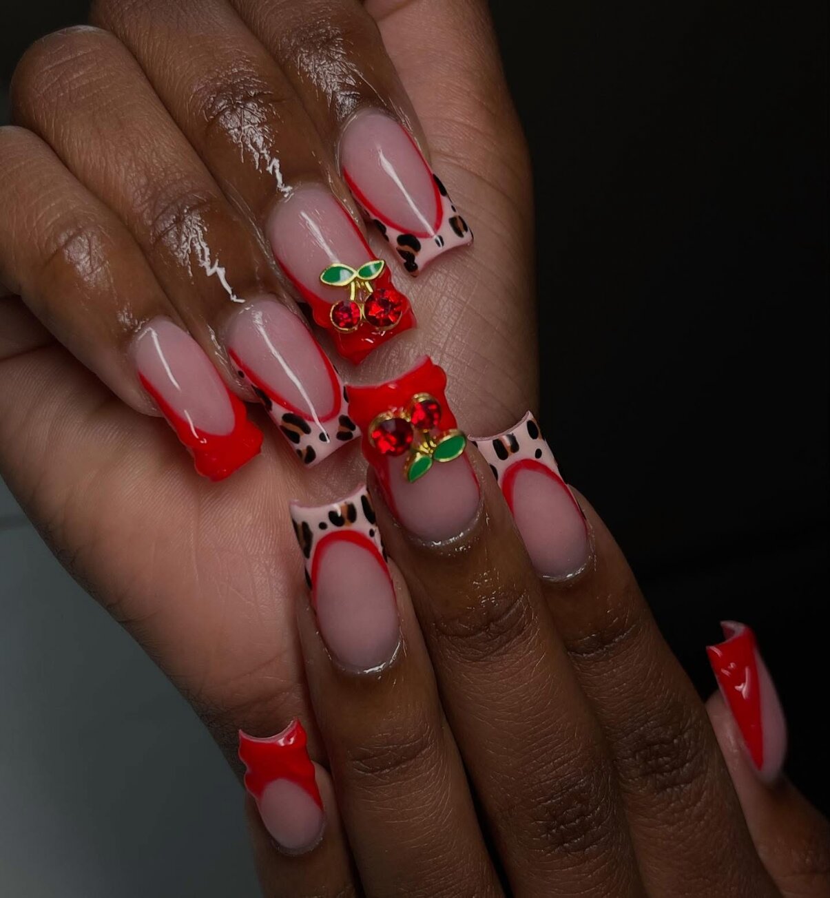 Red French tips with cherry charms and animal print